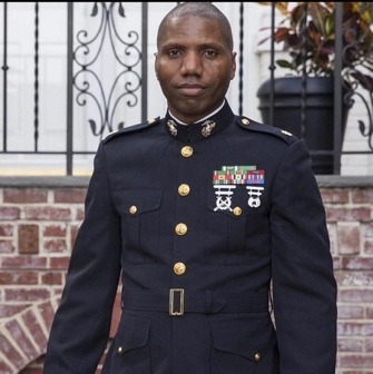 A person in a military uniformDescription automatically generated with medium confidence